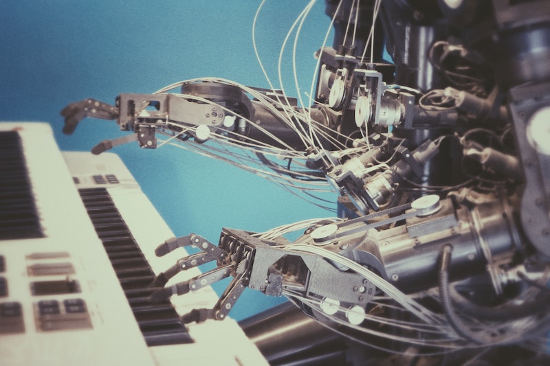 A robot pictures sitting at a piano